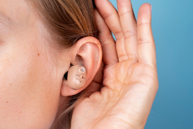 Woman wearing hearing aids side view