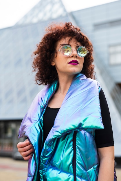 Woman wearing iridescent vest