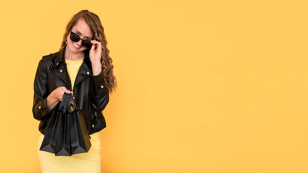 Woman wearing leather jacket copy space