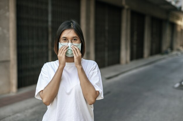 Woman wearing a mask on the street.