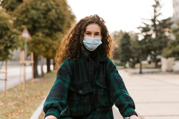 Woman wearing medical mask front view