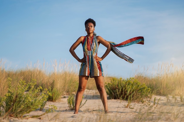 Woman wearing native african clothing in an arid environment