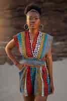 Free photo woman wearing native african clothing at the beach