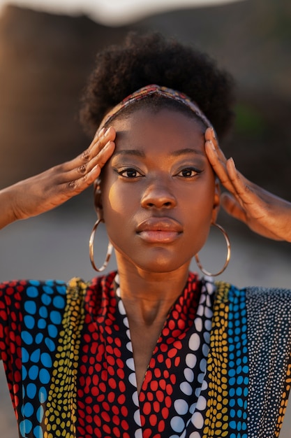 Woman wearing native african clothing at the beach