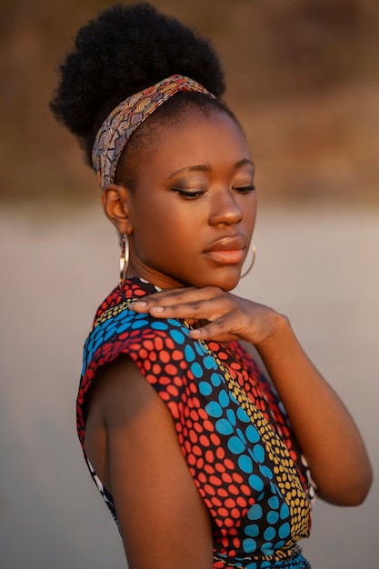 Woman wearing native african clothing at the beach