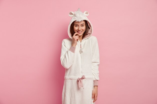 Woman wearing pajamas with bunny ears