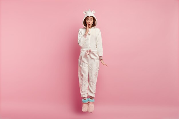 Woman wearing sleep mask and pajamas