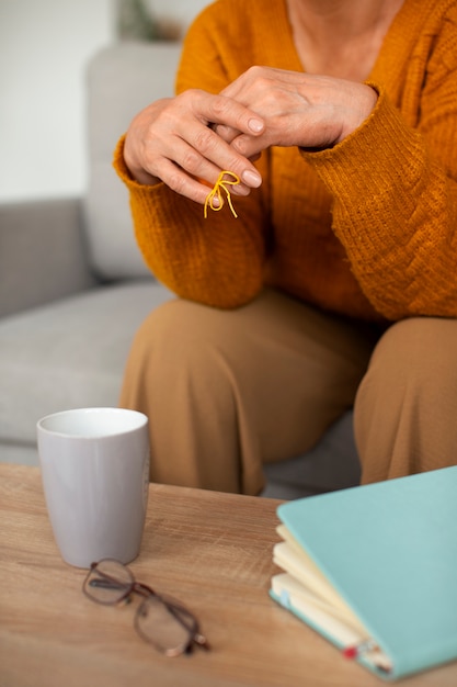 Woman wearing a string on finger for reminder