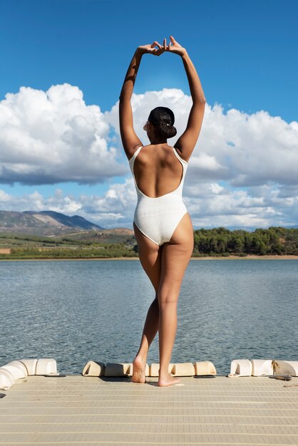 Woman wearing swimsuit back view