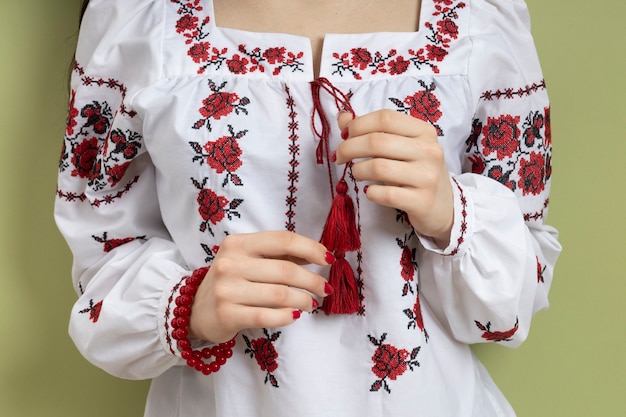 Woman wearing traditional embroidered shirt