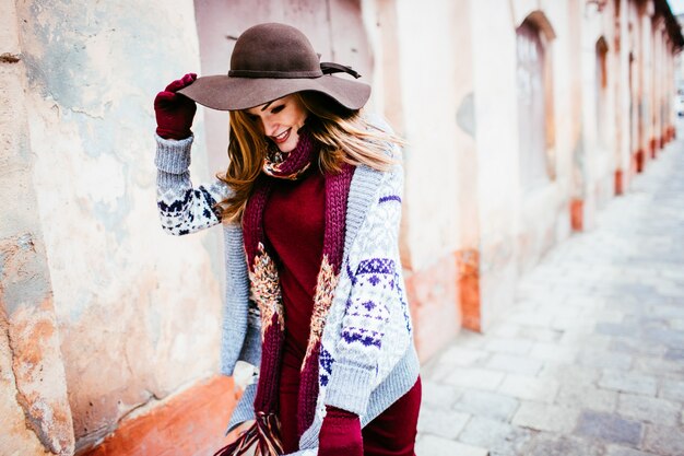 "Woman wearing warm clothing walking outside"