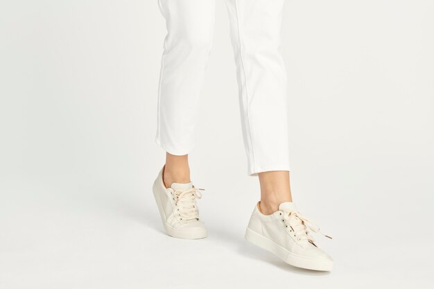 Woman wearing white sneakers mockup