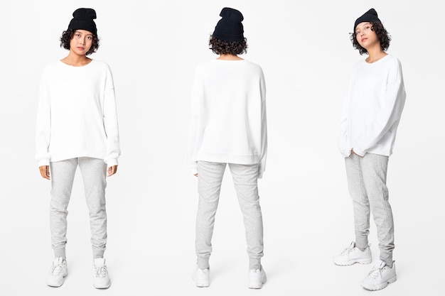 Free photo woman in white basic sweater with design space casual apparel full body set