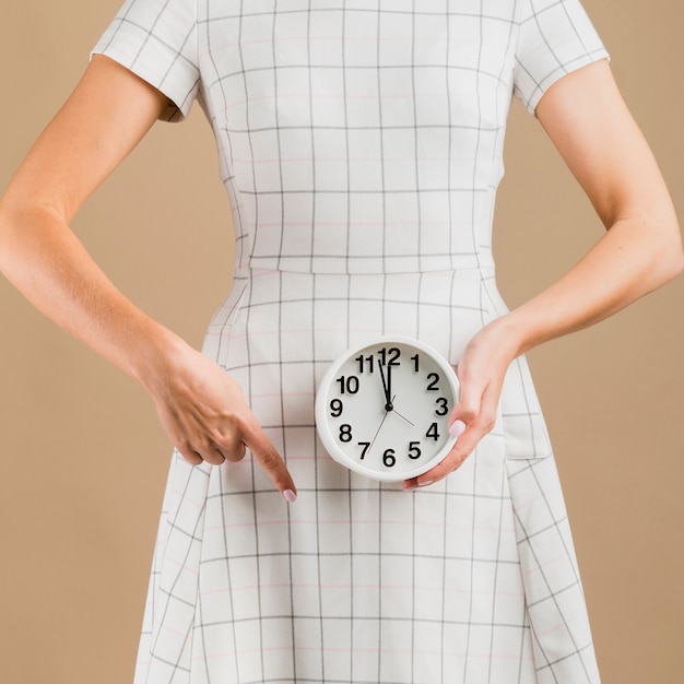 Woman in white dress showing her menstruation period