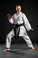 Free photo woman in white karate uniform