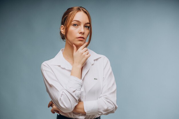 Woman in white shirt showing emotions on blue