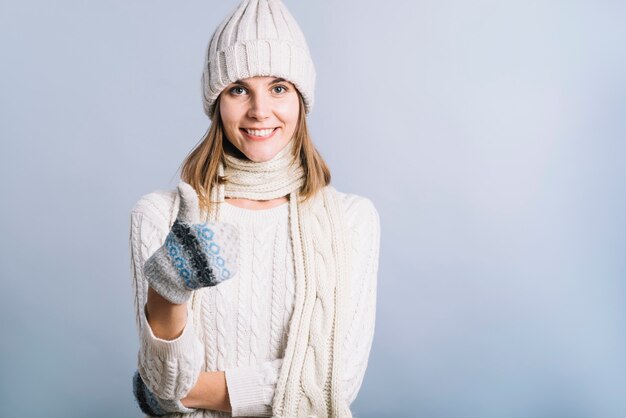 Woman in white showing thumb up 