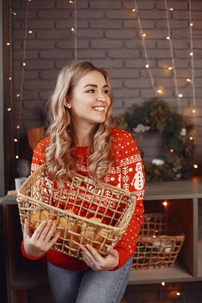 Free photo woman in a white sweater. lady look at the camera.