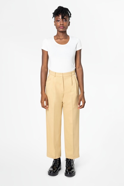 Woman in white tee and beige slacks casual wear fashion full body