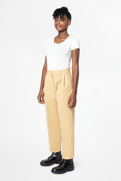 Woman in white tee and beige slacks casual wear fashion full body