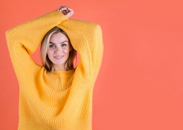 Woman with arms up copy space