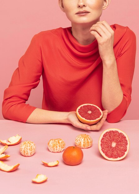 Woman with assortment of fruits