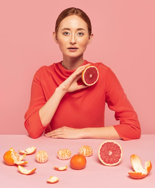 Woman with assortment of fruits