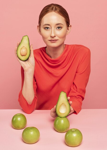 Woman with assortment of fruits