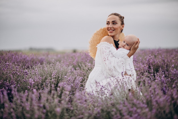 Woman with baby son in a lavander field