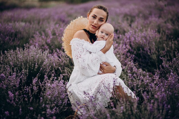 Woman with baby son in a lavander field