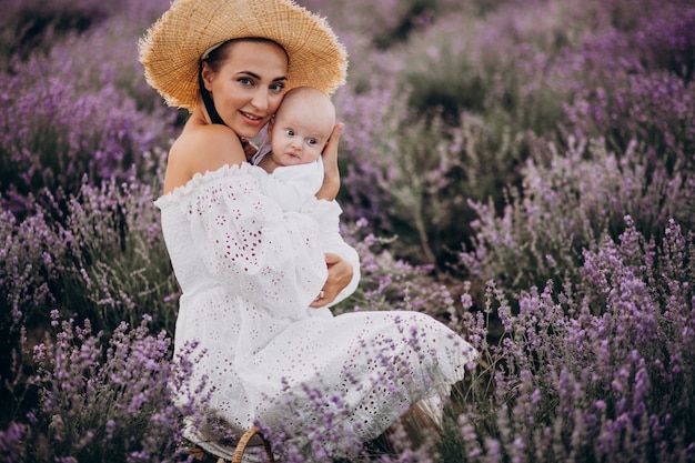 Woman with baby son in a lavander field