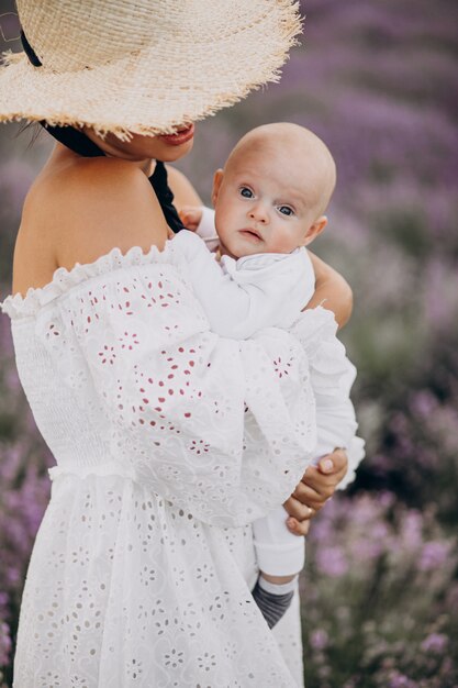 Woman with baby son in a lavander field