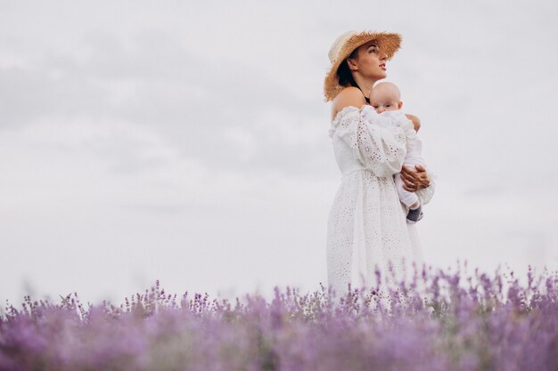 Woman with baby son in a lavander field