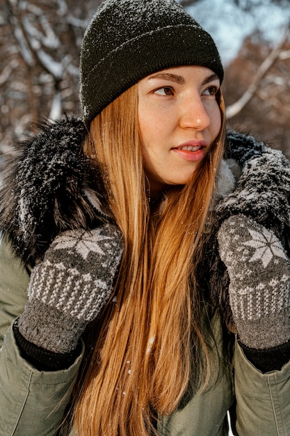 Woman with backpack on winter day