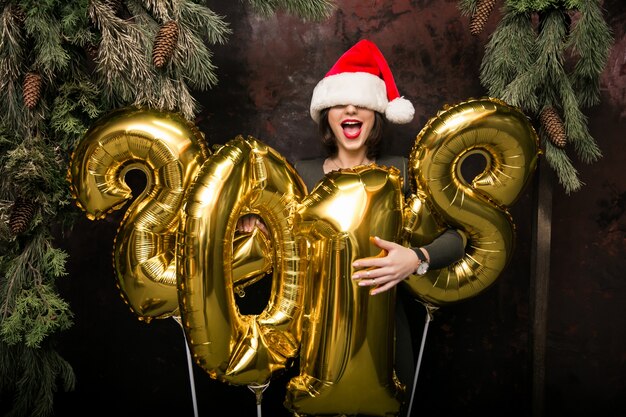 Woman with balloons on New Year