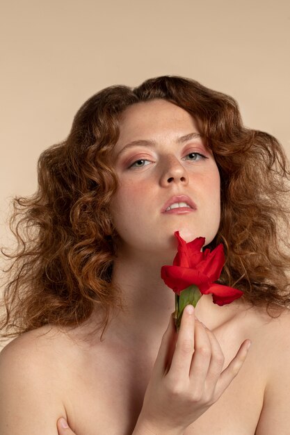 Woman with beautiful gladiolus flowers