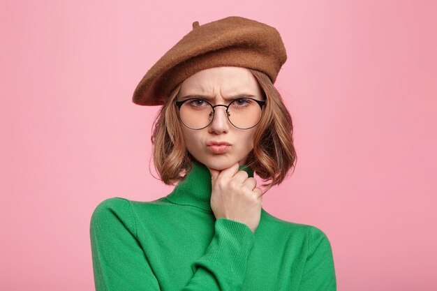 Woman with beret and turtleneck sweater