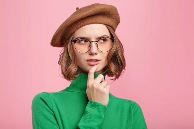 Woman with beret and turtleneck sweater