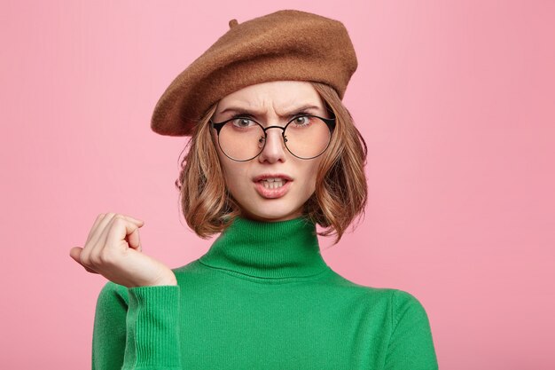 Woman with beret and turtleneck sweater