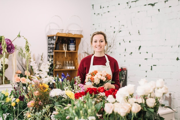 Woman with bouquet in flower shop