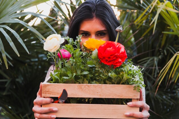 Woman with box with flowers