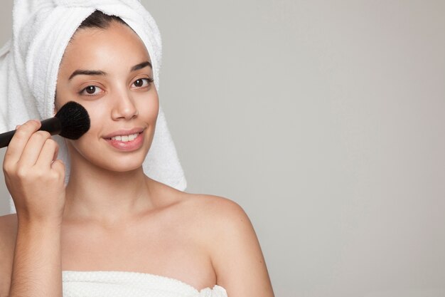 Woman with brush and facial make up