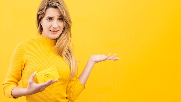 Woman with camera and copy-space