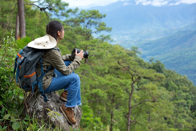 Free photo a woman with a camera world photographer day.