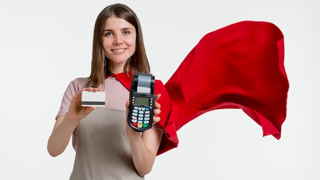 Woman with cape holding pos and card