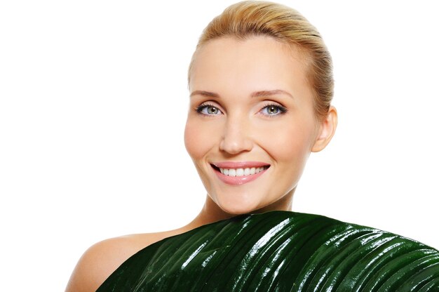 woman with clean health skin  and fresh leaf covering her body