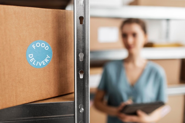 Woman with clipboard in warehouse