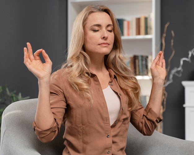 Free photo woman with closed eyes trying to calm herself