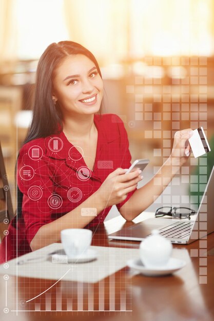 Woman with a coffee and a credit card