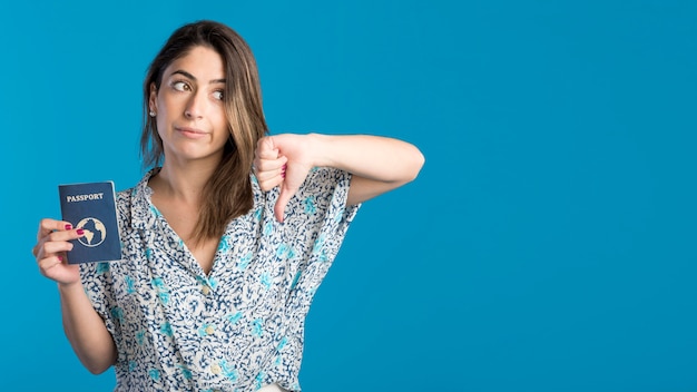 Woman with copy-space holding passport